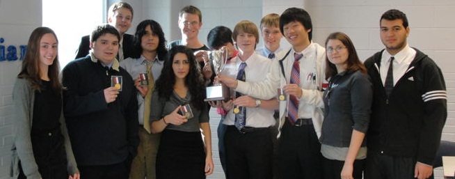 The HHS debate team gathers together after the Regional competition. Harrisonburg took home the school-wide trophy.