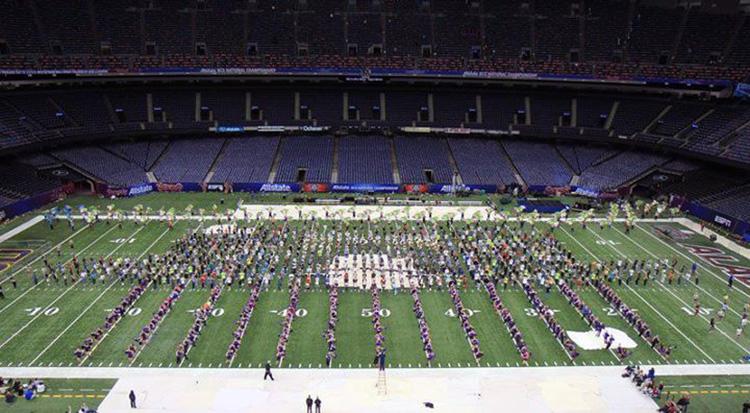 Cheerleaders perform in BCS Bowl's halftime show.