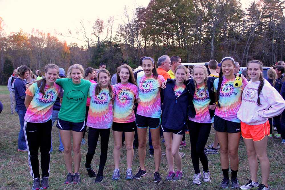 The girls cross country team poses for a team picture after the awards ceremony.