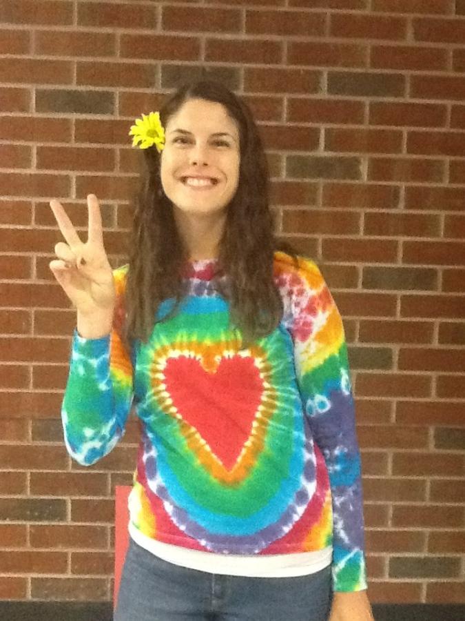 Science teacher Kasey Hovermale completes her 80s outfit with a yellow flower.