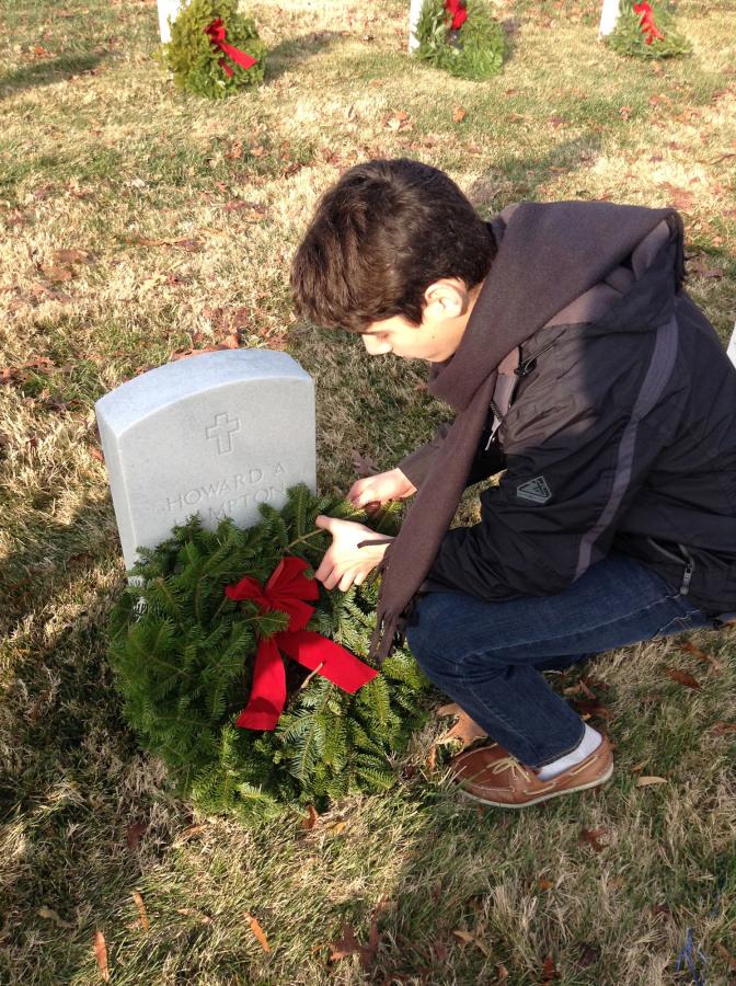 Junior+Nick+Deutsch+laying+wreaths+on+graves.