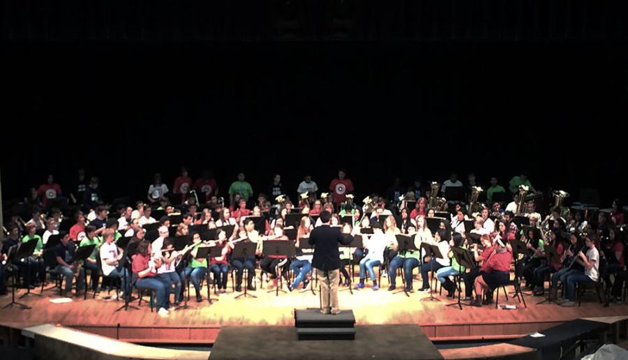 The combined students being directed by Symphonic Band director Daniel Upton.