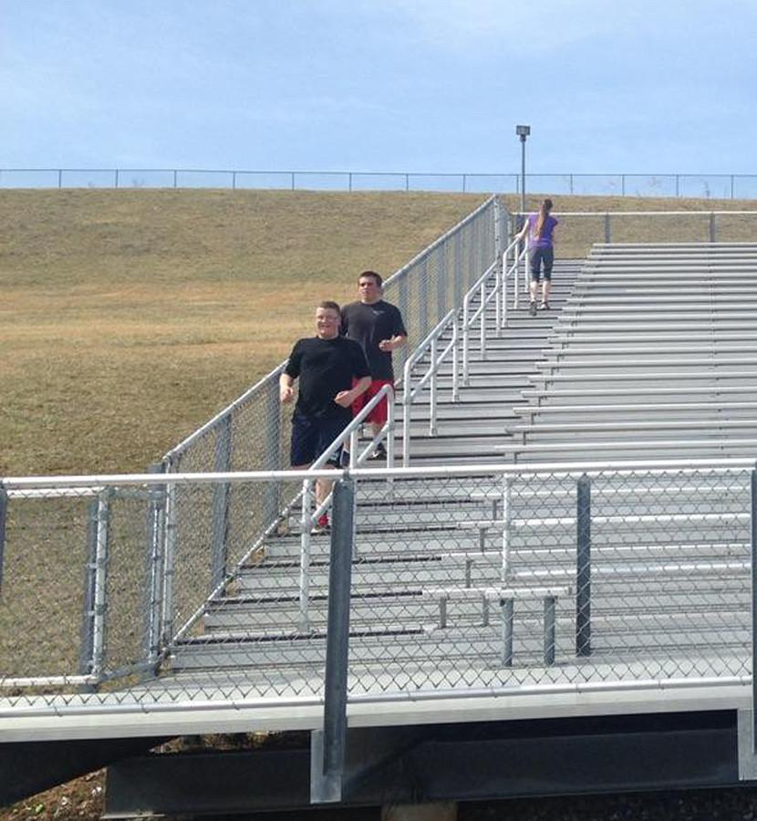 JROTC+students+build+their+endurance+by+running+up+and+down+the+bleachers.