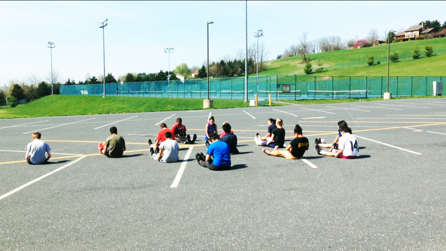 The+members+of+JROTC+stretch+before+beginning+preparations.+