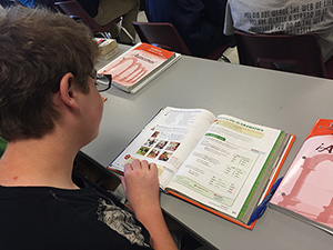 Spanish 2 student, Doyle Dick, reads over his textbook to prepare for their upcoming quiz.