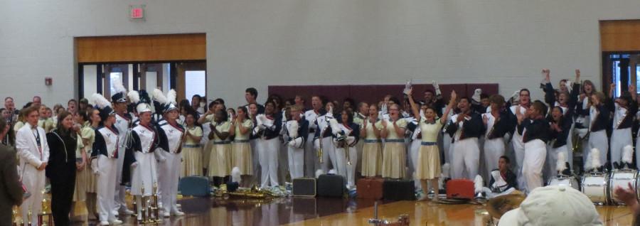 Members of the band cheer at the awards ceremony. 