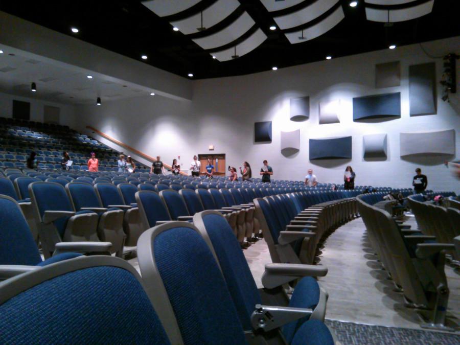 Members of the clinic gather in the auditorium. 