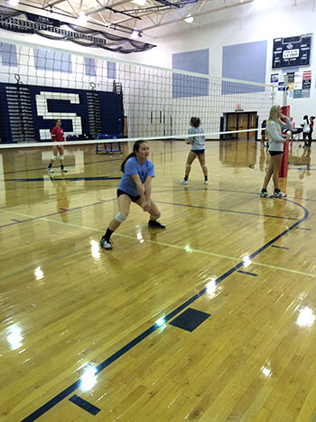 Junior Athena Benton anticipates a hit coming from her partner Jessica Denton.