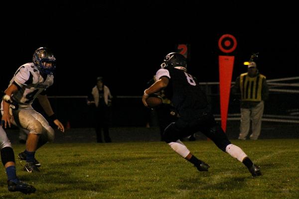 HHS player runs with the ball.