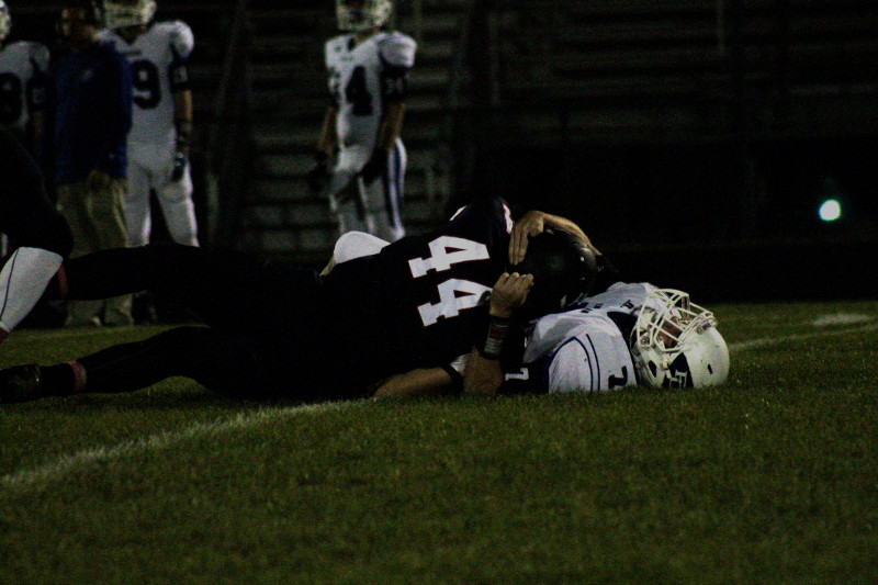 HHS player tackles a Fort Defiance player.