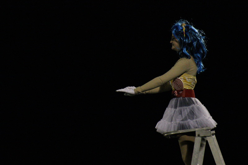 Senior Ava Reynolds directs the band during the half time show