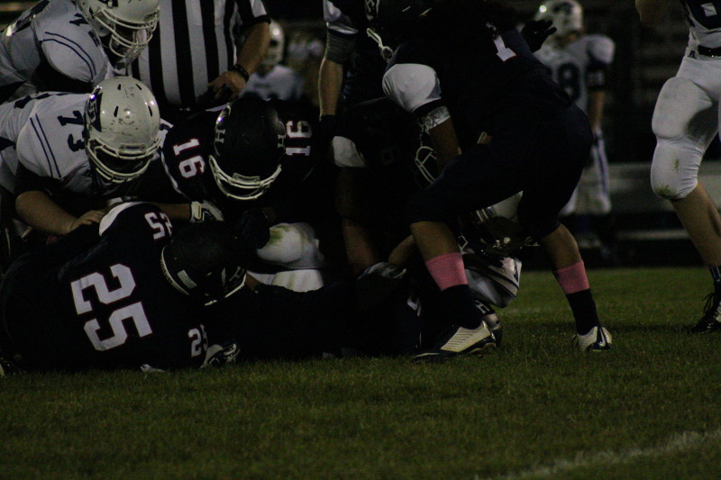 HHS players tackle a Fort Defiance player.