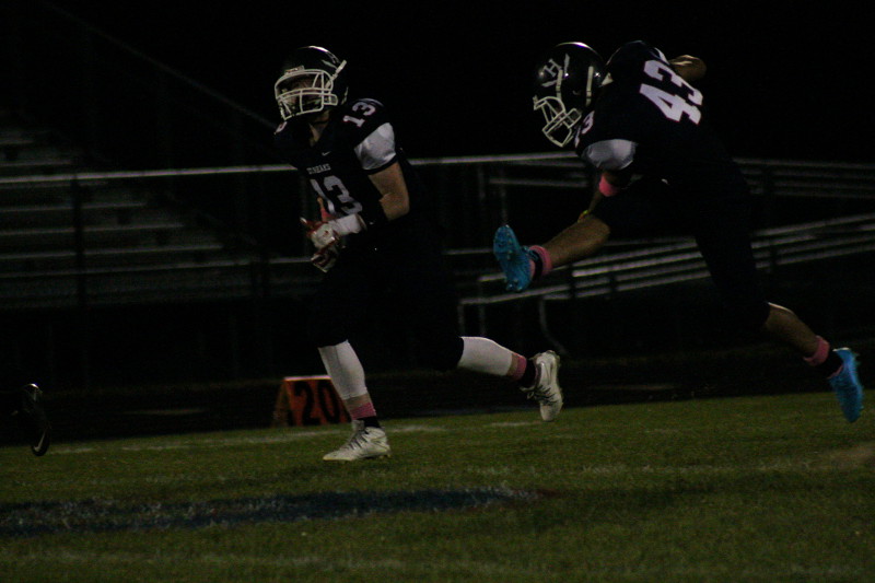HHS player punts the ball.