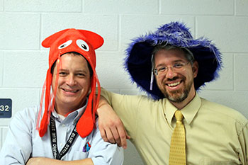 Math teachers Geoffray Estes and Brain Nussbaum pose together, wearing hats for spirit day on Monday. Spirit week will continue all throughout Homecoming celebration.
