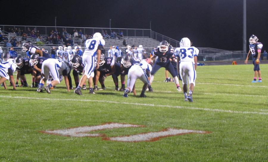The HHS offensive line prepares to block for the extra point kick.