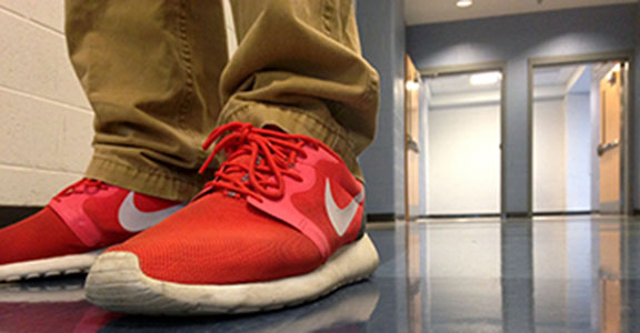 Freshman Walker Thompson wears his red Roshe Runs to school frequently.