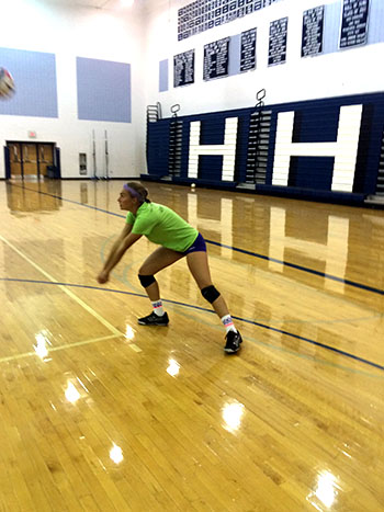 Junior Jessica Denton digs a hit from her partner Athena Denton.
