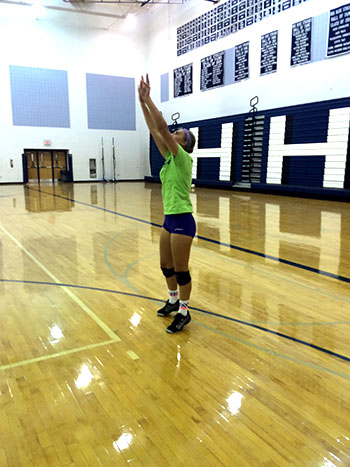 Junior Jessica practices setting to her partner so that she can receive a hit in the next rally.