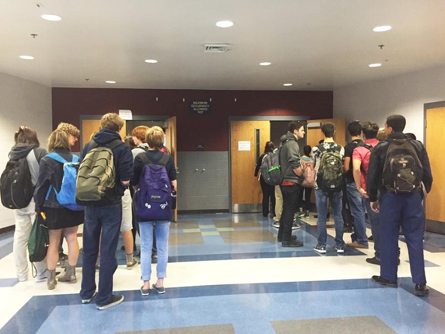 Students wait outside the the auditorium to take the test. The test was soon canceled due to a mistake. 