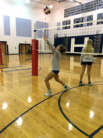 Senior Sophia Hartman is winding up to hit at her partner.