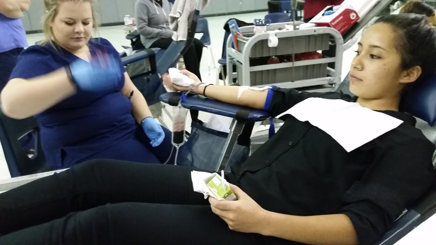 Junior Abrianna Castro giving blood at the annual fall blood drive.