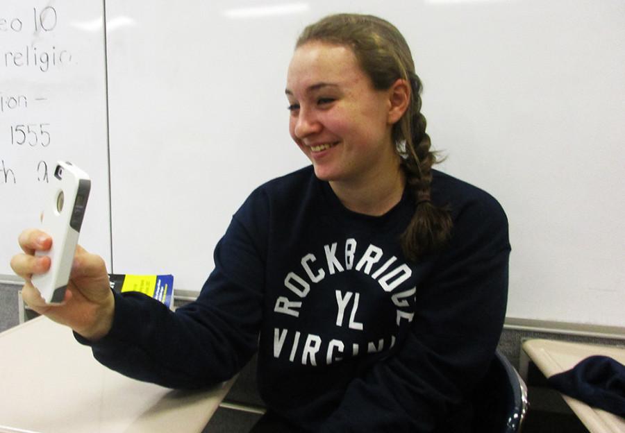 Junior Julie Hedrick takes a selfie during class. 