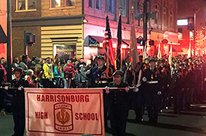 JROTC members hold their banner in the front 