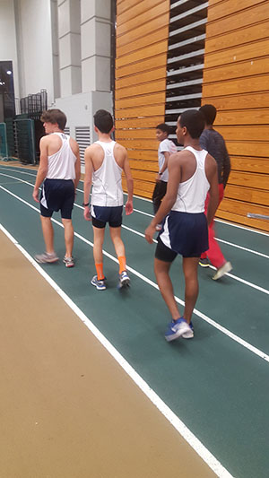 The boys 4x800m relay team warms up before their event. 
