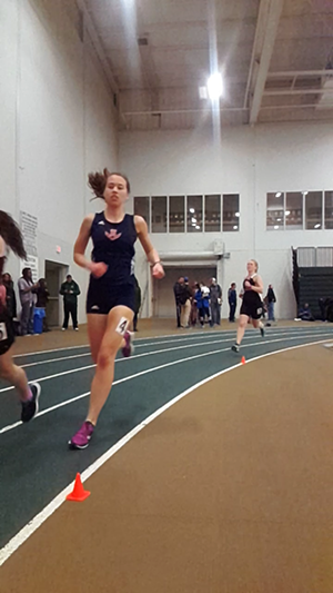 Allison Kasch paces during the mile run.