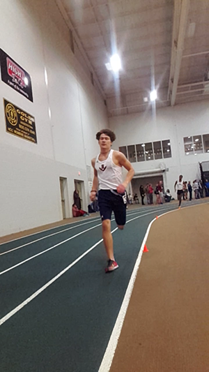 Patrick Badia turns the corner of his third lap in the 1000m run.