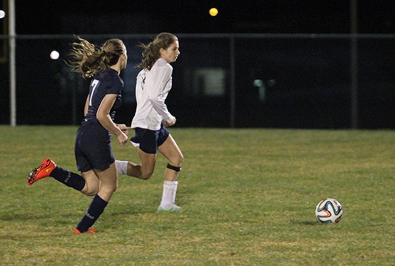 Abby Campillo chases after the ball against a Millbrook attacker.
