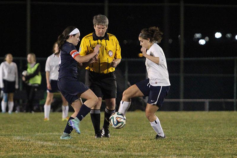 Sophia Hartman goes for the ball after the referee drops it.