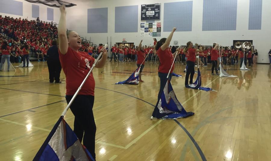The Color Guard and band energize the students of HHS at the beginning of the Pep Rally.