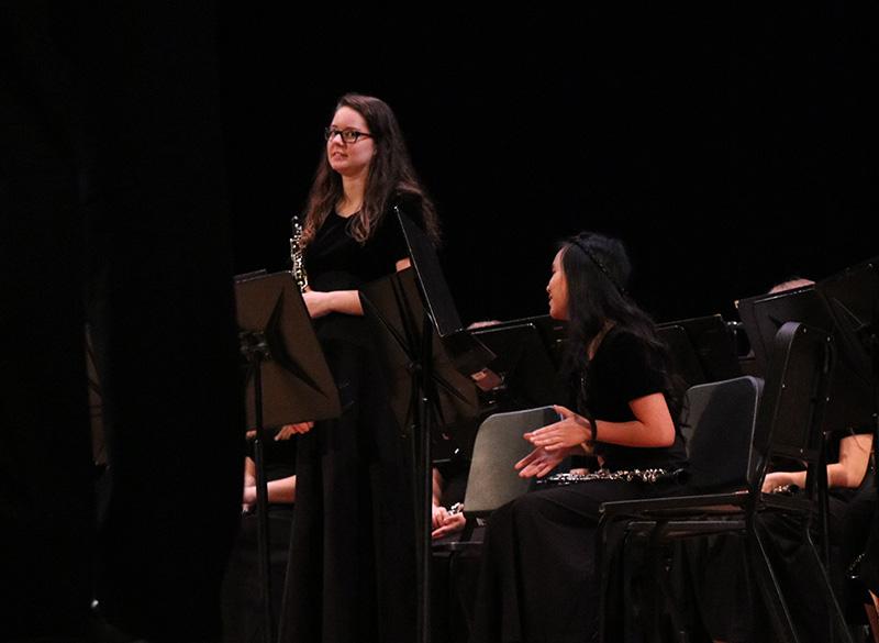Senior Laura Ruple stands after playing a solo with the symphonic band.