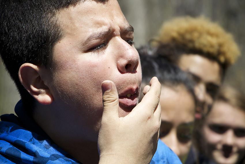 Kevin Aguilar, on the verge of coughing up the crackers during a MRE cracker eating competition in survival training