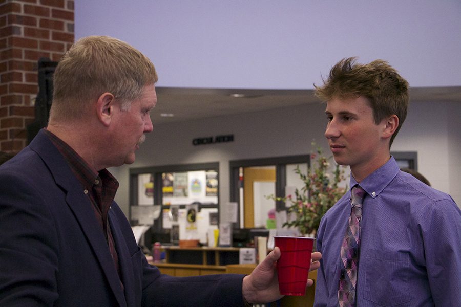 Students talk with local politicians.