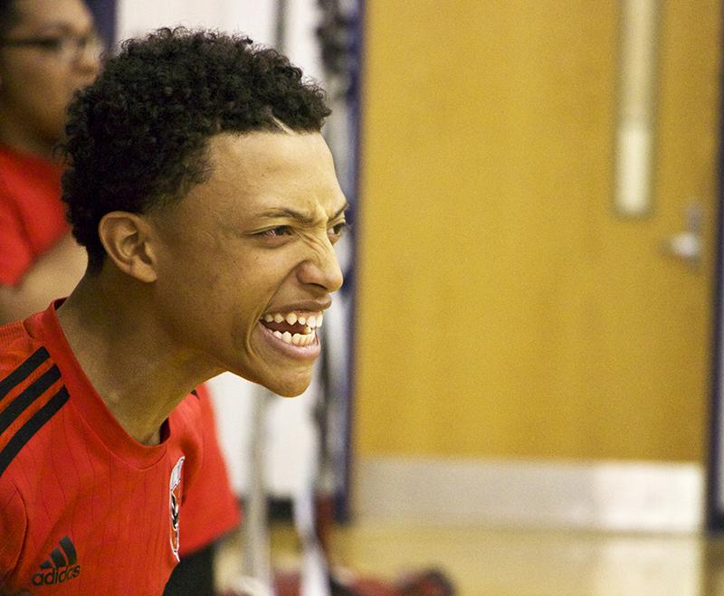 Junior Kajuan Madden gets excited after a point scored by the junior team.