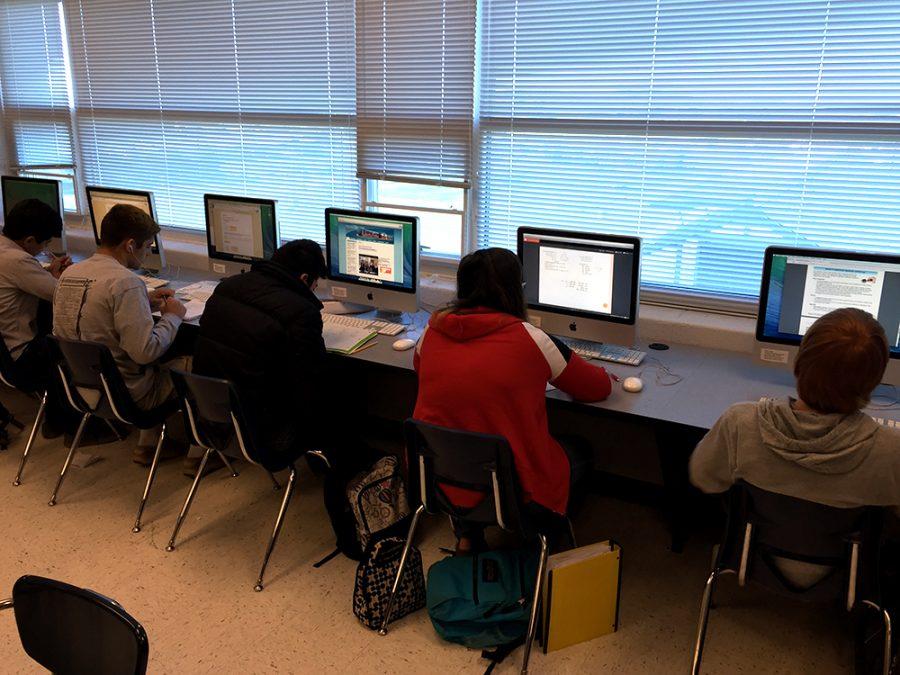 Students work hard at their computers during class.