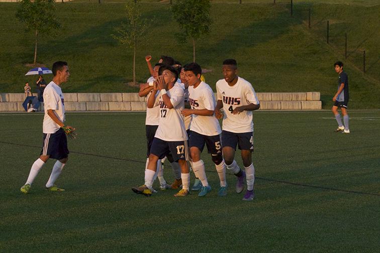 The Streaks celebrate after the goal scored by freshman forward Carlos Pacheco. This goal put the Streaks in the lead 1-0 over Millbrook.