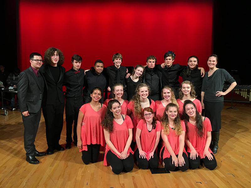 The percussion two and dance classes pose with their directors after the concert. 