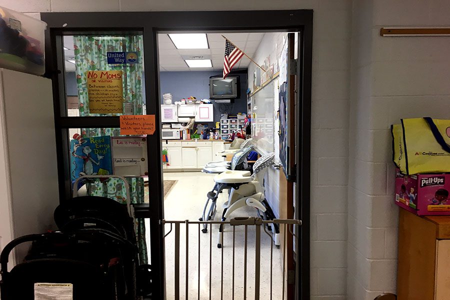 The daycare door is open for mothers in the morning but the gate remains up for the kids.