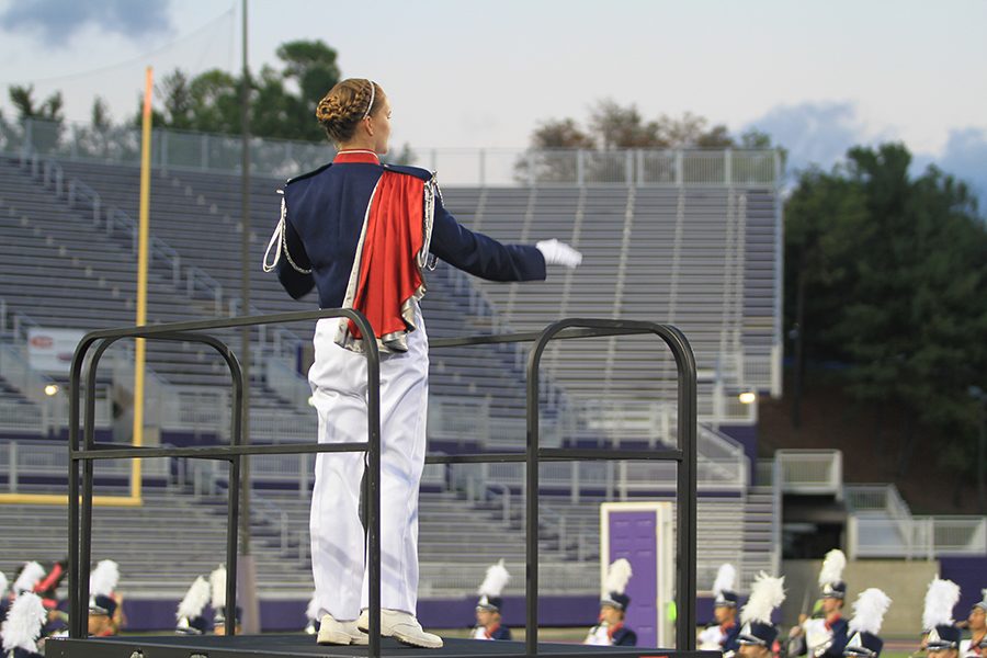 Drum Major Emily Werner begins conducting the band. 