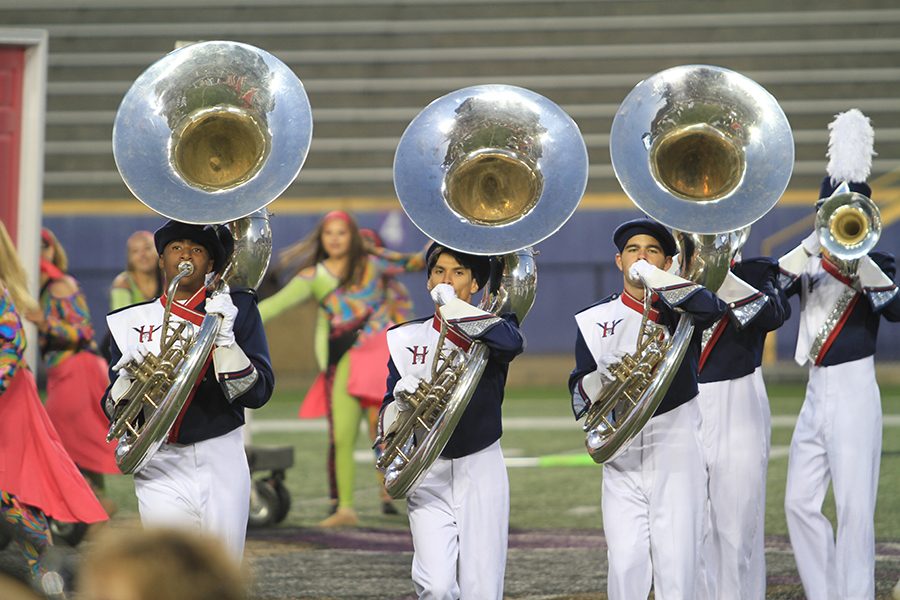 Freshman David Sinclair, senior Tony Gomez and sophomore Andrew Ely (left to right) play the sousaphone. 