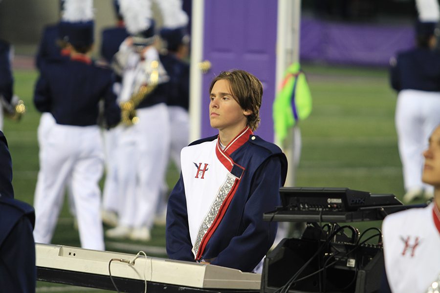 Sophomore Noah Pope waits on the cadence to begin playing the keyboard. 