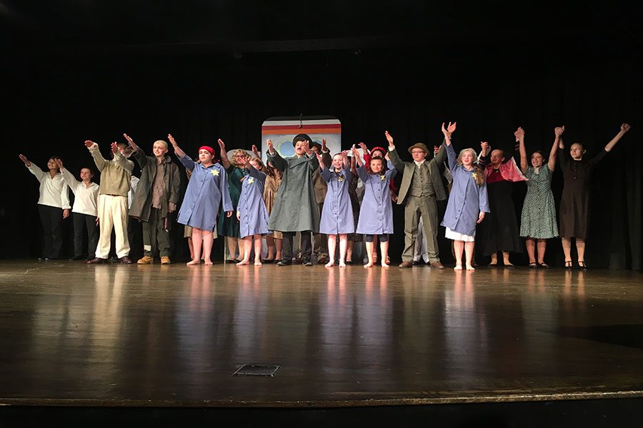 Cast waves goodbye to audience to conclude the performance. 