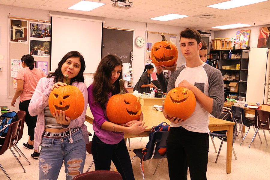 Newcomers carve pumpkins