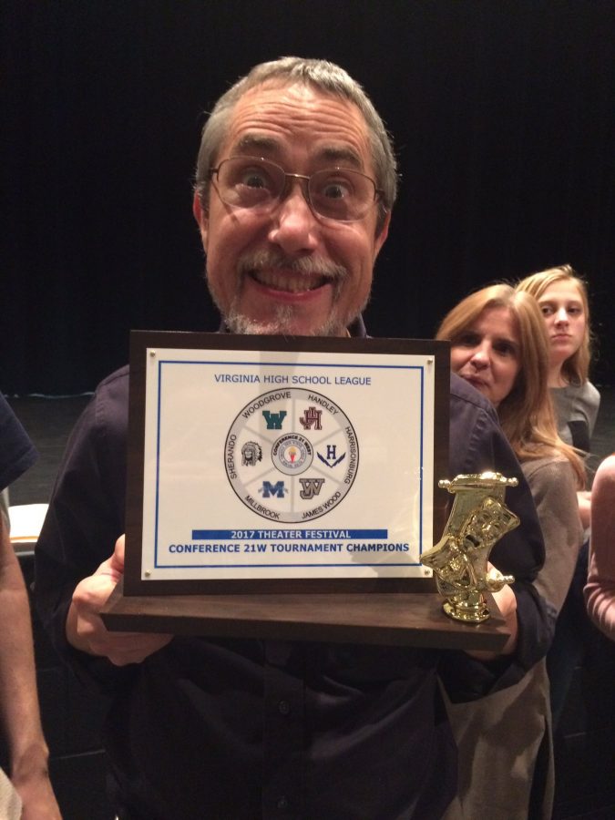Director Stanley Swartz poses with the conference award