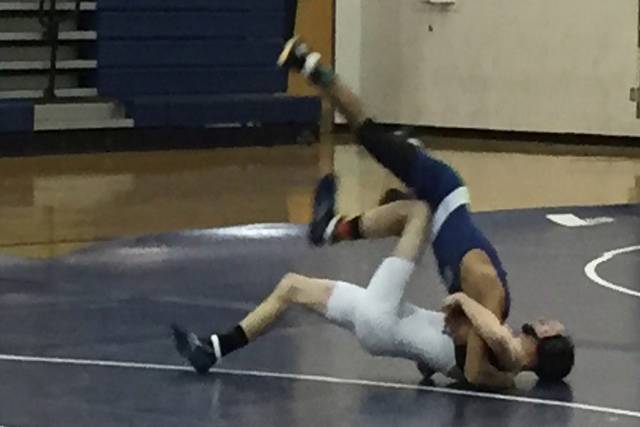Greg Castillo puts down another wrestler during the match