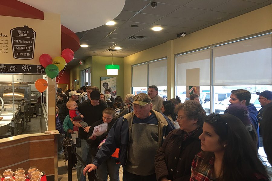 Customers crowd the new Krispy Kreme store