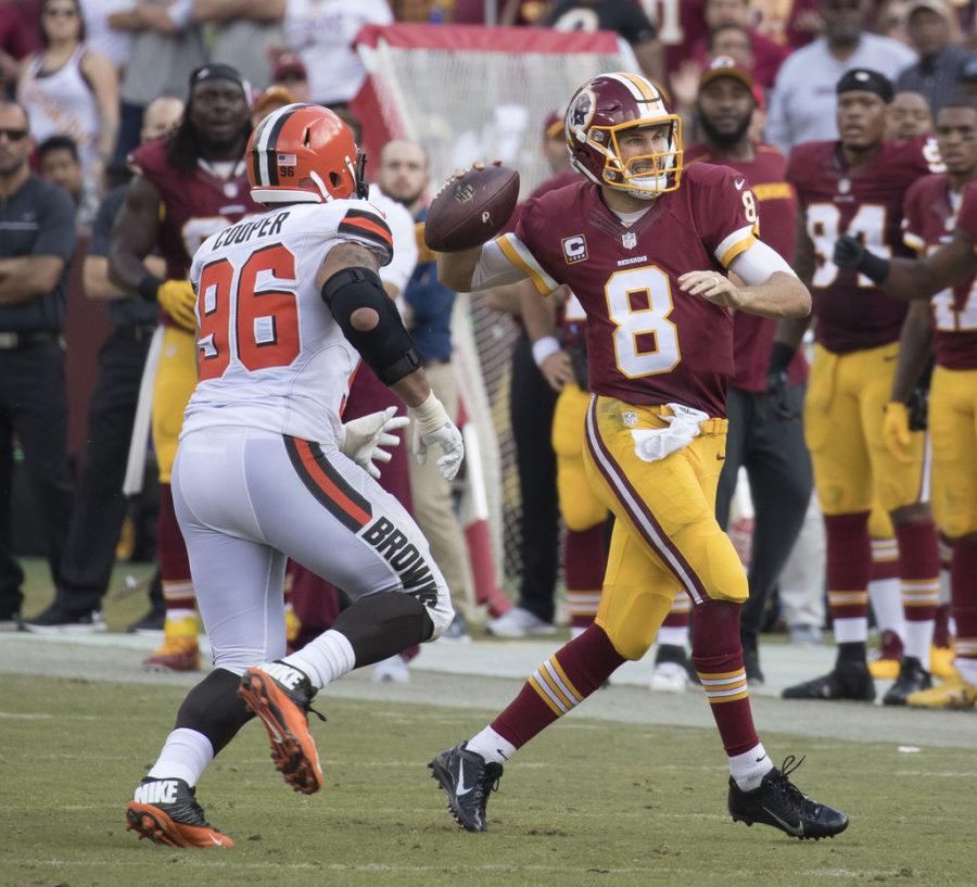 Washington Redskins quarterback Kirk Cousins rolls out for to pass during a regular season game against the Cleveland Browns in October of 2016. Cousins signed a franchise tag for the second straight season.